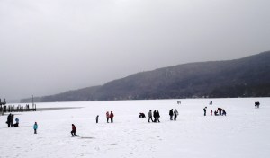 people hanging out on the frozen lake