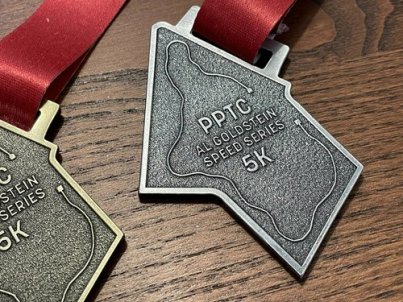Al Goldstein Speed Series 5k medal